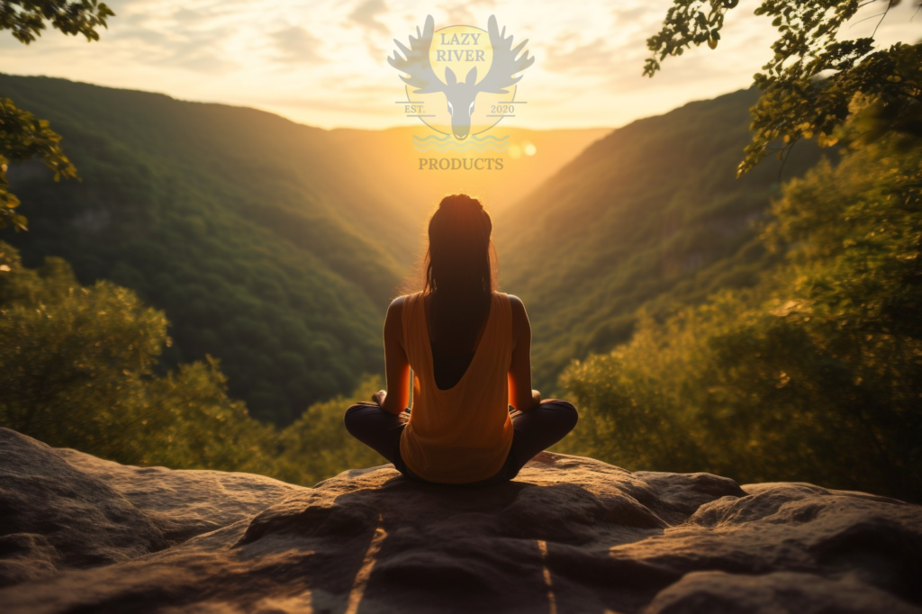 woman meditating on the top of luscious mountain tops